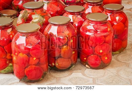 Tinned Tomatoes In Big Glass Jars.
