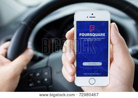 Iphone 5S App Foursquare In Hands Of The Driver Car