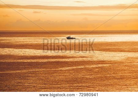 Vessel Is Sailing In The Ocean At Sunrise