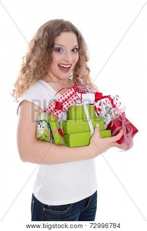 Three quarter length shot of pretty young woman with pile of gift boxes over white background. 