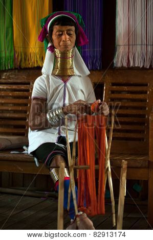 A Kayan Lahwi Oldest Woman Is Spinning.