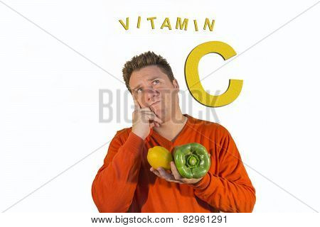 Thoughtful Man Holding Fruits And Vegetables
