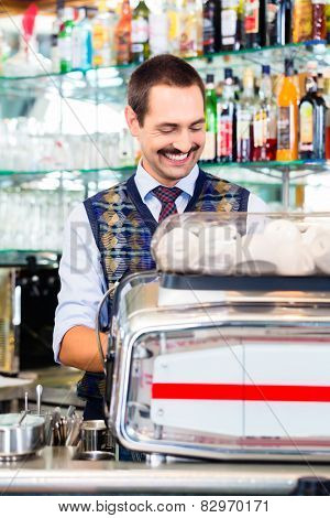Barista preparing coffee in cafe bar using professional espresso machine