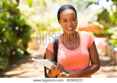 pretty female africa college student going to class