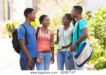 happy afro american university students chatting outdoors