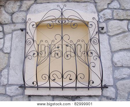 Decorative Wrought Iron Grille On Walled Window