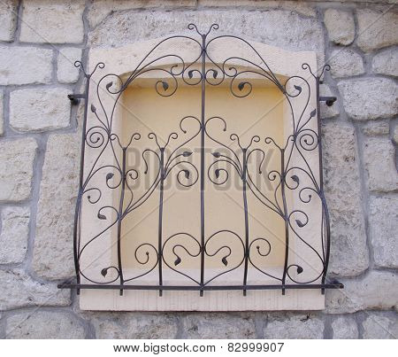 Decorative Wrought Iron Grille On Walled Window