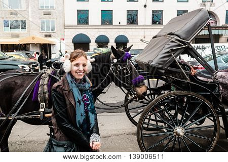 Girl Inf Front Of Horse And Carriage Near Central Park In Manhattan, New York Ciry
