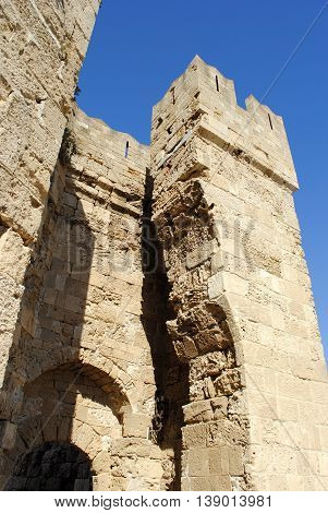 towers at the entrance to the ancient castle in Rhodes