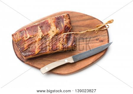 Fresh smooked bacon with knife isolated on white background.
