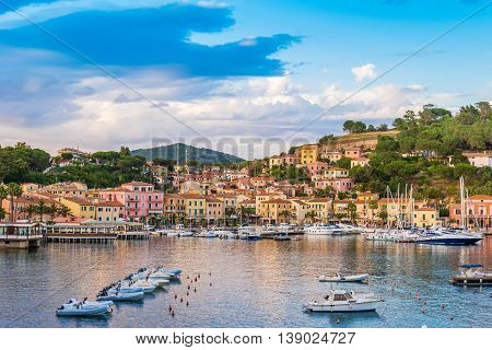 Panoramic view over the famous town Porto Azzurro in sunset light, in Elba island of Italy, Europe