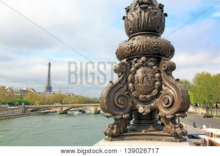 Candelabra on the Alexandre III bridge. Fluctuat nec mergitur, emblem of Paris. (Paris, France)