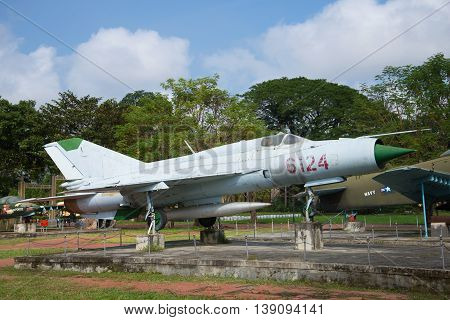 HUE, VIETNAM - JANUARY 08, 2016: The Soviet MIG-21 stands on a pedestal in the city of Hue. Historical landmark of the Vietnam