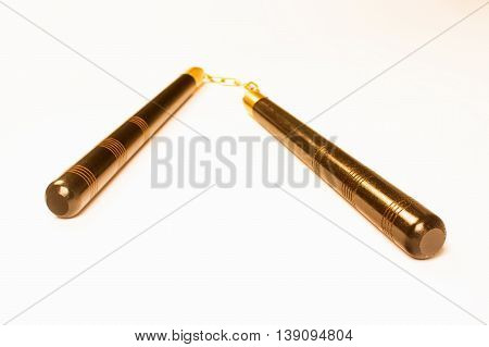 Bronze nunchaku the asian weapon is isolated on white background.