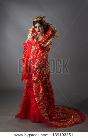 Beautiful Asian Model Young Asia Oriental Woman Wearing Chinese Qipao Dress - Studio Shot