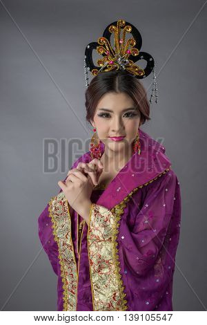 Beautiful Asian Model Young Asia Oriental Woman Wearing Chinese Qipao Dress - Studio Shot