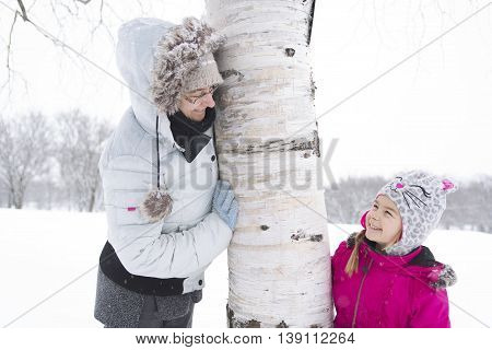 A portrait of little girl in snowy park