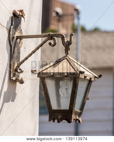Old Street Light Fixture Mounted On A Wall White With Decorative Details