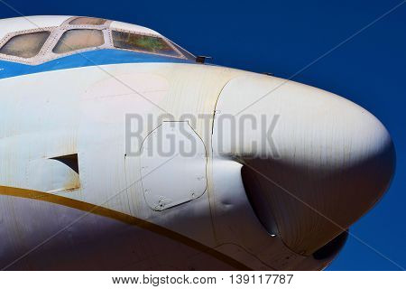 Cockpit windows and the front of an airliner aircraft taken in an airplane boneyard