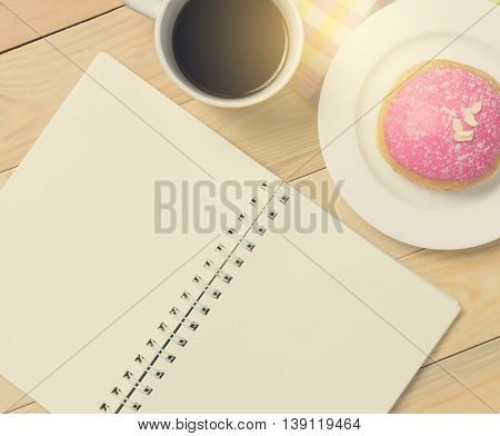 Blank open notebook for text on a Coffee table.