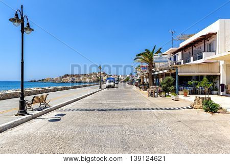 PALEOCHORA, CRETE, GREECE - JUNE 26, 2016: Promenade with tavernas at Paleochora town on Crete island