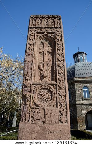 Stone cross in Echmiadzin (Vagharshapat) made of red stone tufa ,medieval christian art,Armenia ,Caucasus ,unesco world heritage site