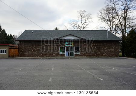 HARBOR SPRINGS, MICHIGAN / UNITED STATES - DECEMBER 25, 2015: One may purchase pet supplies, pet food, and bird seed at MacGregor's Pet Pantry in Harbor Springs.