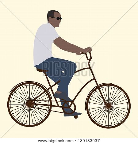 Summer activities male cyclist in black glasses riding a bike flat style