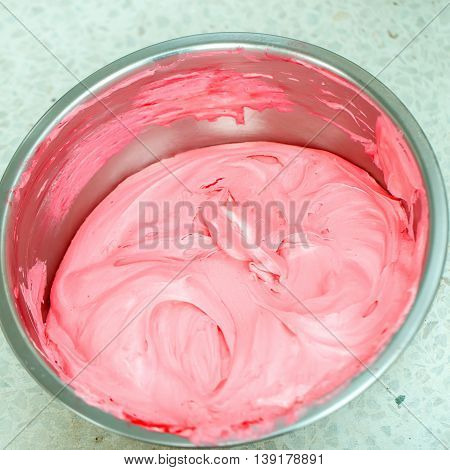 Homemade ice cream pink yummy sweet cold dessert in metallic bowl on light background