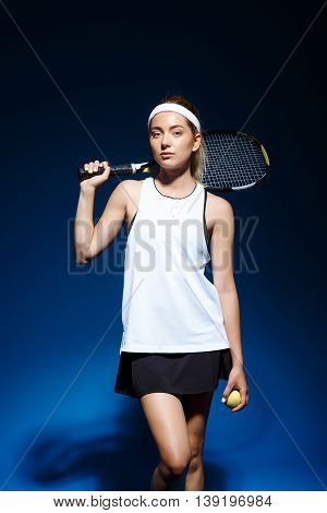 Picture of young fintess girl holding tennis racket