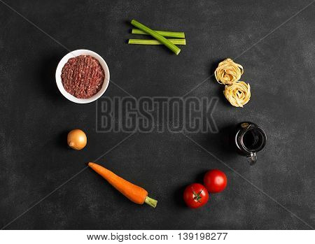 Ingredients of pasta bolognese. Italian cuisine. Copy space for text