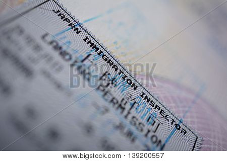 Printed passport stamp with a caption Landing permission in black ink as a part of Japanese Visa page