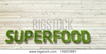 superfood made of grass on white wood background