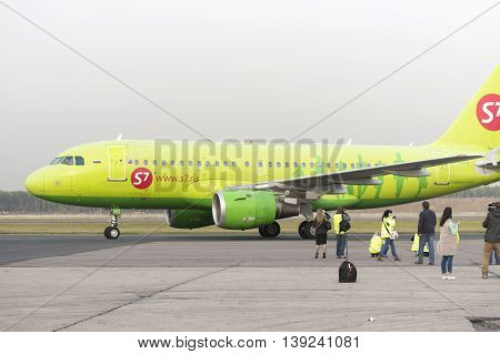 MOSCOW, RUSSIA - SEPTEMBER 26, 2014: Spotter plane photographed S7 Airlines during taxiing. Moscow Domodedovo Airport organizes regular spotting on its territory.