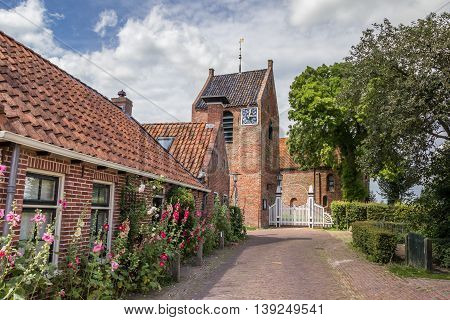 Central street and church tower of Ezinge Netherlands