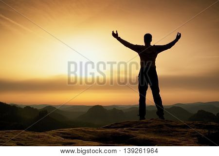 Happy Man With Open Raised Arms Gesture Of Triumph. Satisfy Hiker  Silhouette