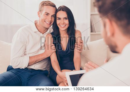 Young Happy Couple On Reception For Family Psychologist