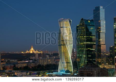 MOSCOW - JUN 13, 2016: Modern Moscow International Business Center at summer evening and MSU. Years of construction of complex - 1995-2018