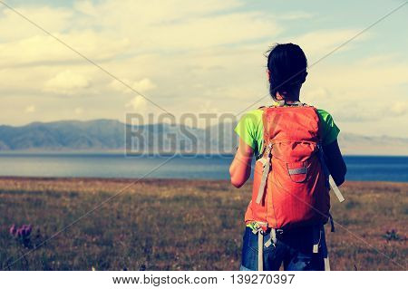 one young woman backpacker enjoy the view