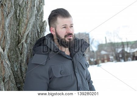 A Gorgeous young man looking outdoors in winter season