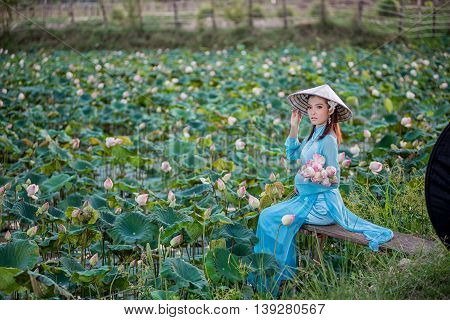 Asian Office Woman, Ao Dai Is Famous Traditional Costume For Woman In Vietnam