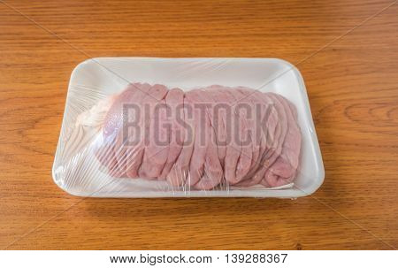Fresh chitterlings on wood table