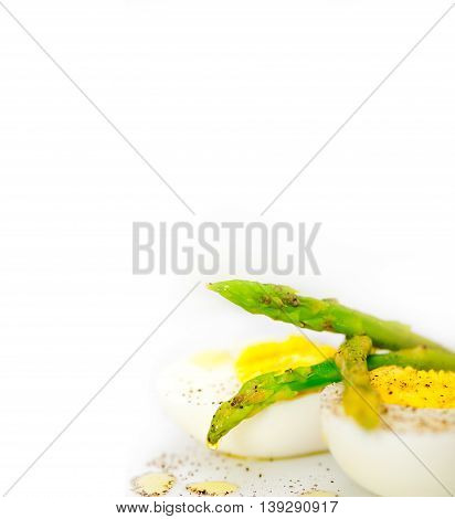 asparagus and eggs isolated on a white background