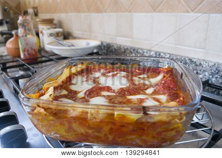 bolognese lasagne with bechamel sauce in a glass bowl