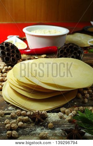 Colorful Indian food - papadum chickpea gram flour and spices on textured wooden table top