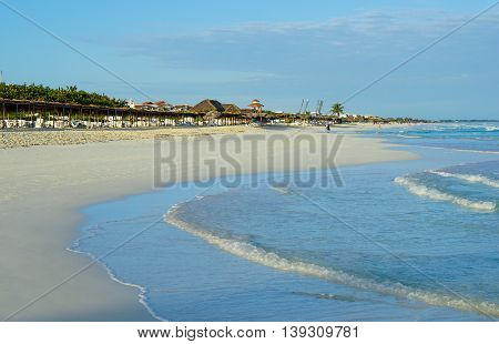 Wonderful tropical beach in Cuba with crystal clear water sunshine and palm leaf sun Umbrellas