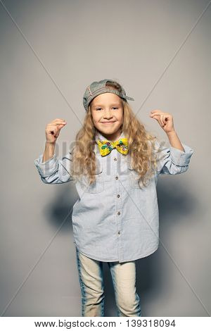 Dansing child. Motions fashion girl studio shot