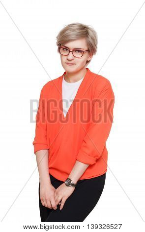 Blond stylish shy woman in eyeglasses. Young fashionable businesswoman in casual clothes. Beautiful attractive female portrait isolated at white background.