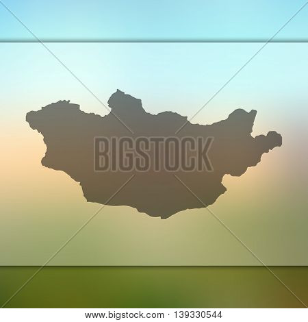 Mongolia map on blurred background. Blurred background with silhouette of Mongolia. Mongolia. Mongolia map.