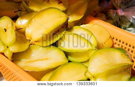Ripe starfruit in basket at farmer's market